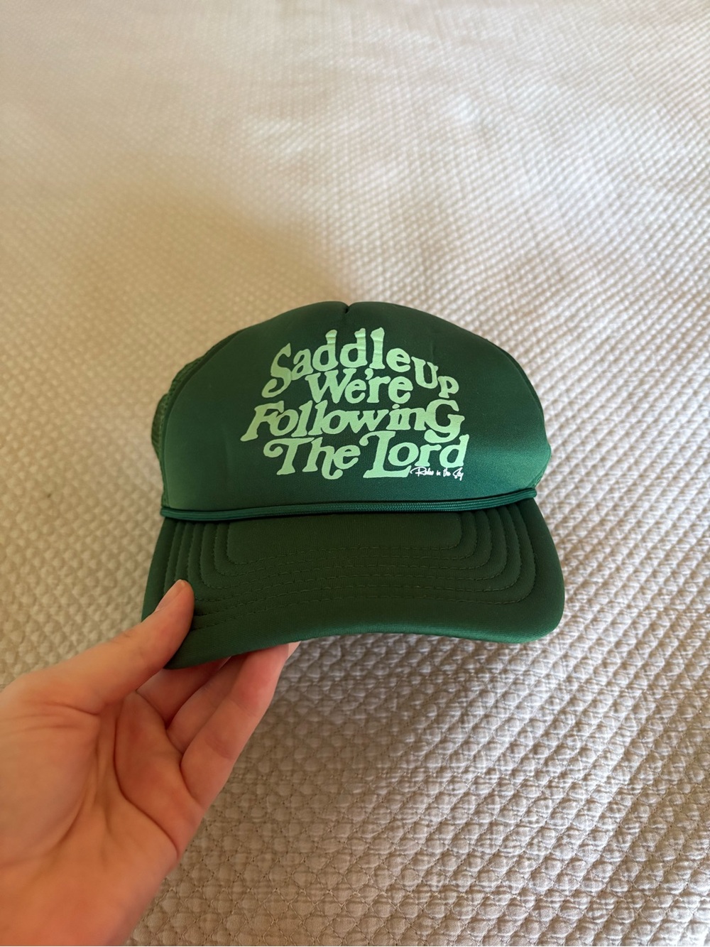 Saddle Up Were Following The Lord Green Trucker Hat